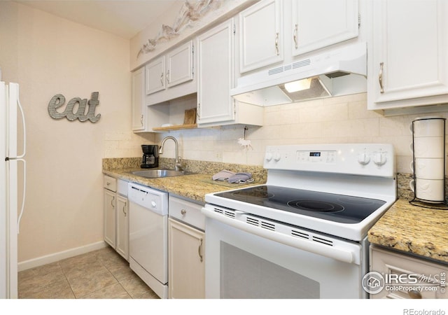 kitchen with white appliances, tasteful backsplash, white cabinetry, sink, and light tile floors