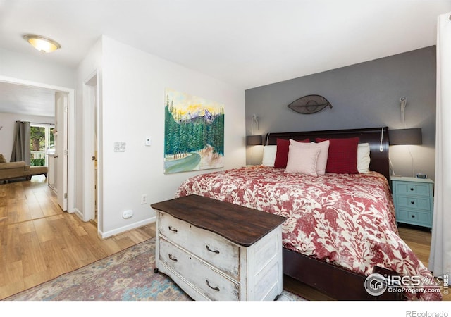 bedroom with hardwood / wood-style flooring