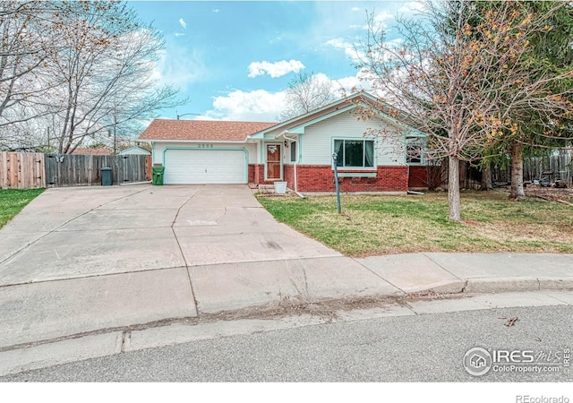 view of front of home with a garage and a front lawn