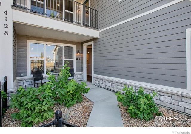 property entrance with a balcony