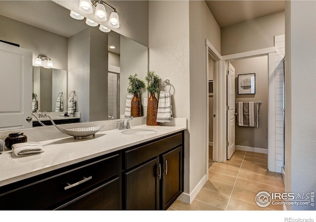 bathroom with vanity and tile patterned floors