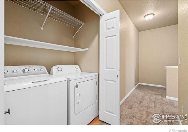 6925 19th St Unit 15, Greeley, CO 80634 - washroom with separate washer and dryer and light carpet