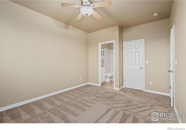 6925 19th St Unit 15, Greeley, CO 80634 - unfurnished bedroom with carpet floors, ceiling fan, and ensuite bathroom