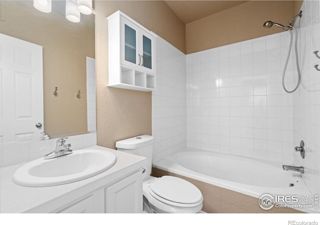 6925 19th St Unit 15, Greeley, CO 80634 - full bathroom with tiled shower / bath, toilet, and vanity