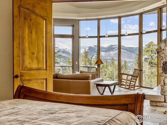 bedroom featuring a mountain view