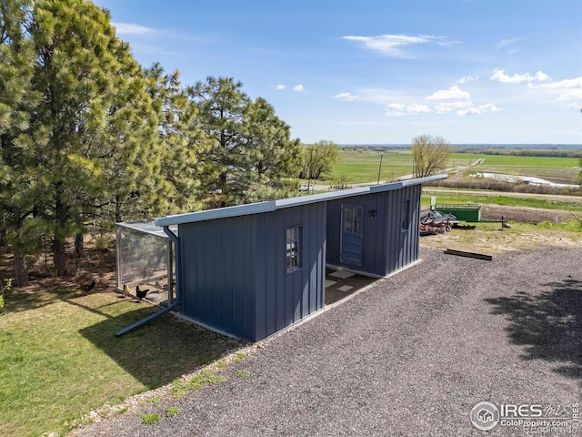 view of outbuilding featuring a rural view