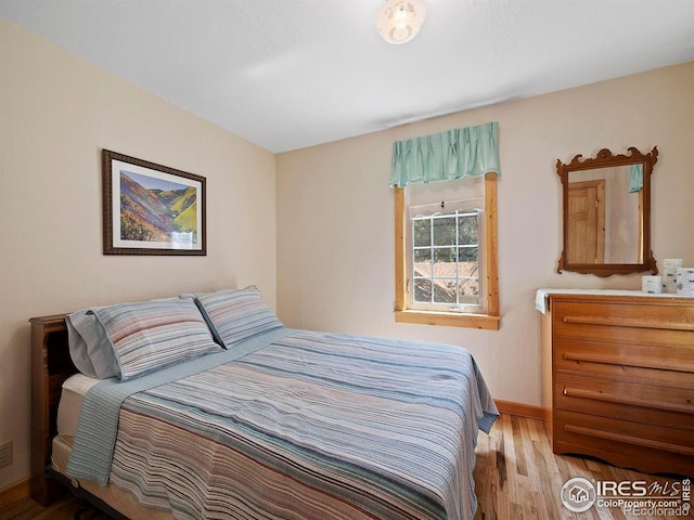 bedroom with light wood-type flooring