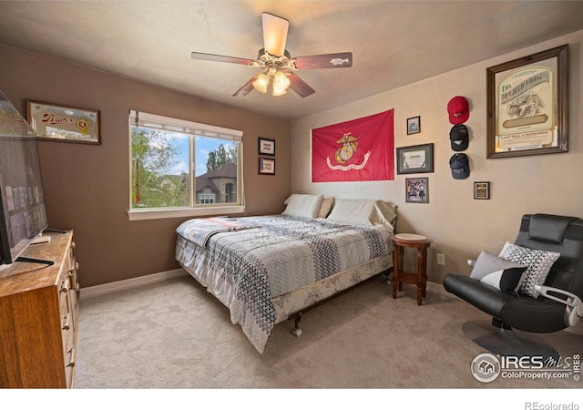 carpeted bedroom with ceiling fan