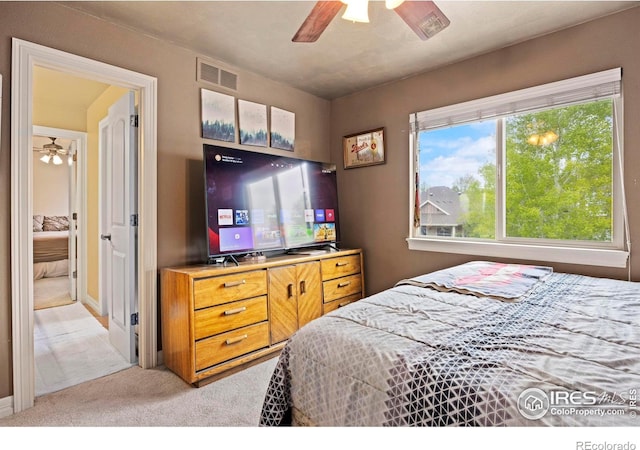 carpeted bedroom featuring ceiling fan