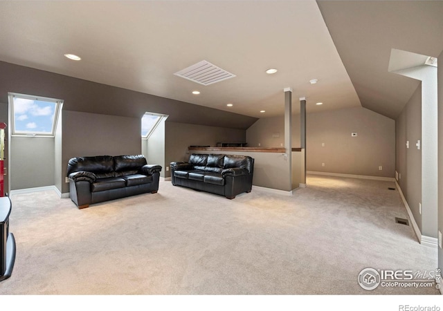 living room with light colored carpet and vaulted ceiling