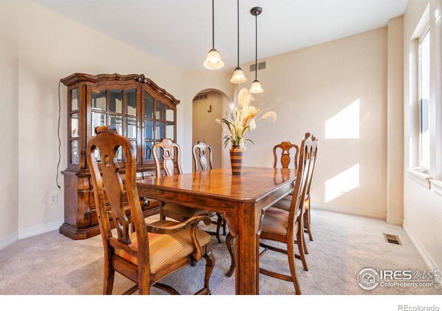 view of carpeted dining area