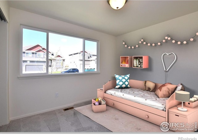 bedroom featuring carpet