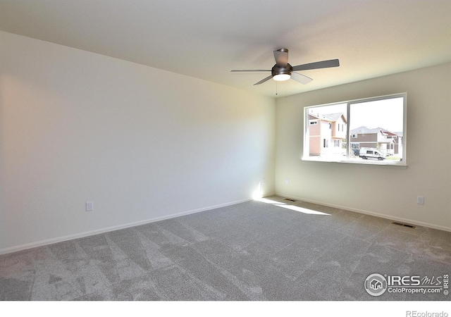 carpeted empty room with ceiling fan