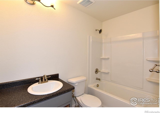 full bathroom featuring shower / bathing tub combination, vanity, and toilet