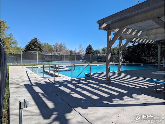 view of pool with a patio and a pergola