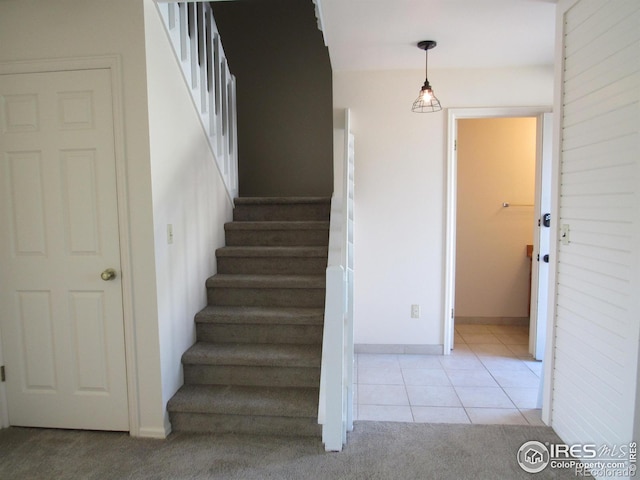 staircase with tile floors