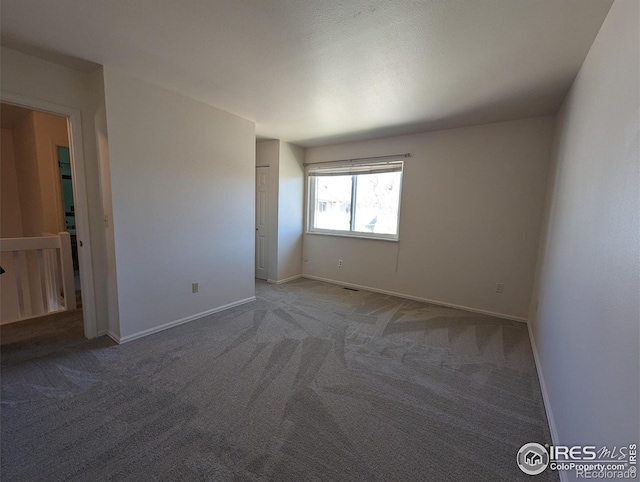 empty room featuring carpet floors