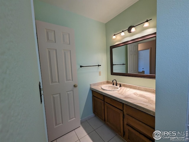 bathroom with tile flooring and large vanity