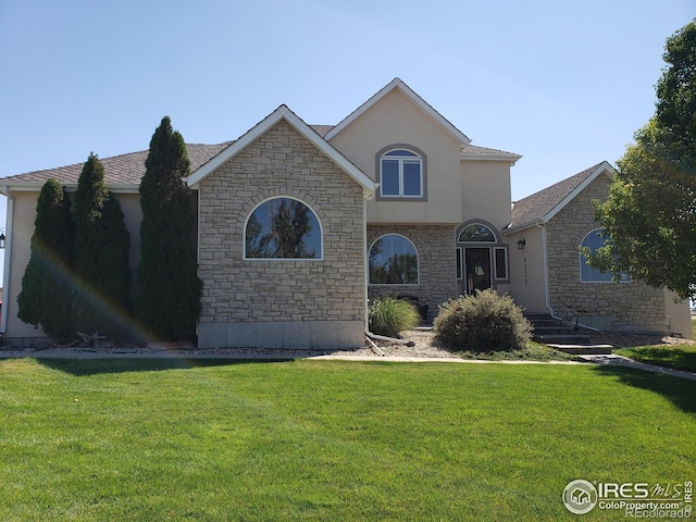 view of front of house with a front lawn