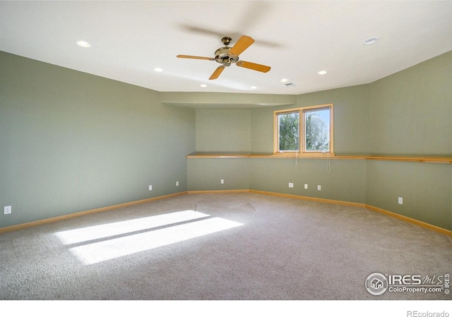 empty room with ceiling fan and carpet floors