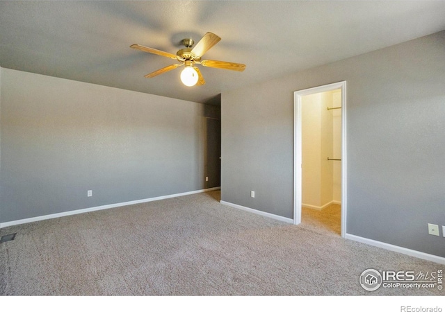 unfurnished bedroom featuring ceiling fan and light colored carpet