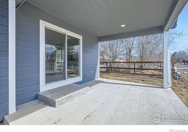 view of patio featuring fence