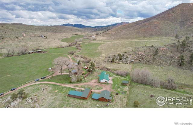 bird's eye view featuring a mountain view and a rural view