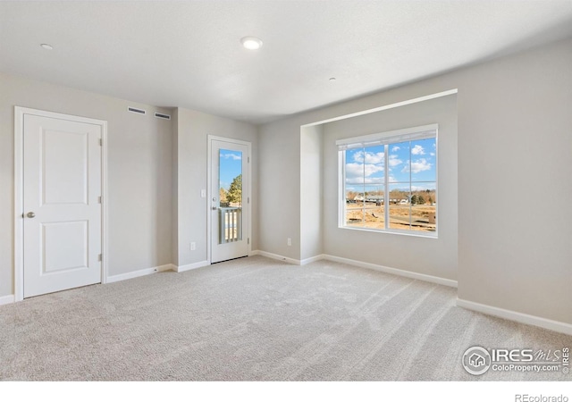 view of carpeted spare room