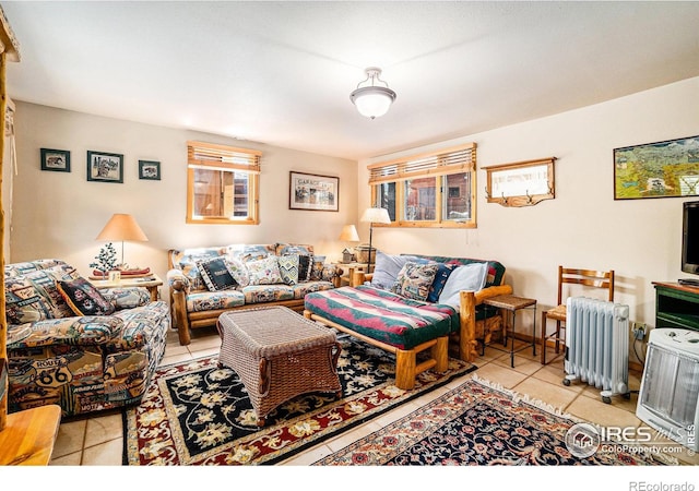 tiled living room featuring radiator