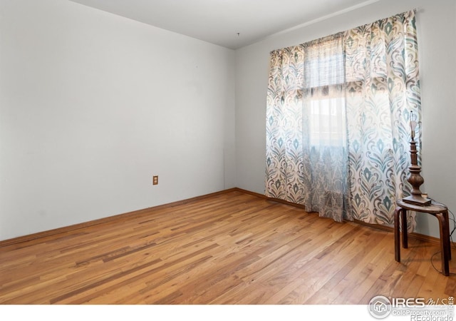 spare room featuring light wood-type flooring