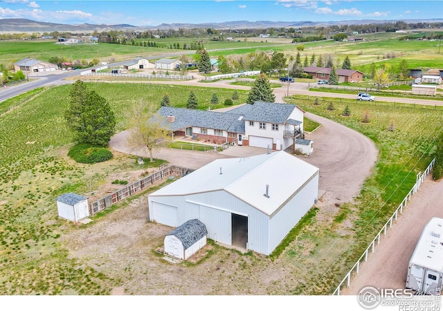 aerial view featuring a mountain view and a rural view