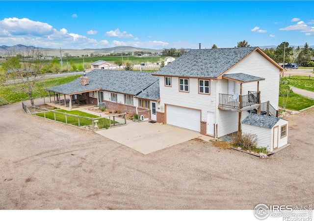 view of front of house with a mountain view and a garage