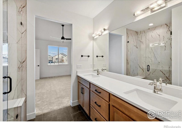 bathroom featuring tile patterned floors, ceiling fan, an enclosed shower, and vanity