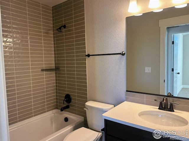 full bathroom with tiled shower / bath combo, toilet, and vanity