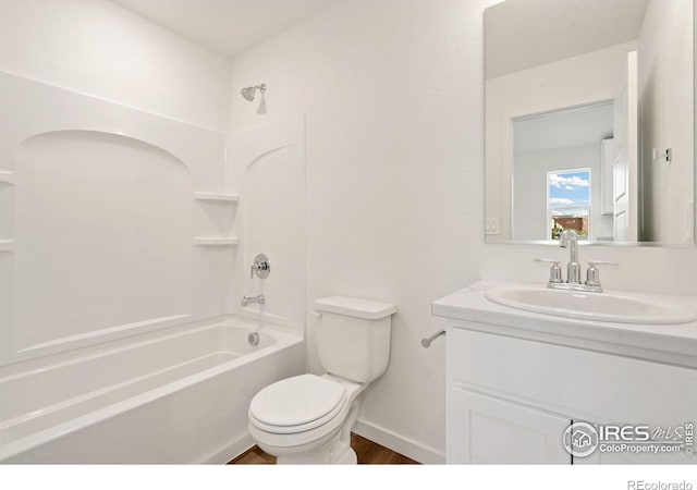 full bathroom featuring toilet, vanity, and shower / washtub combination