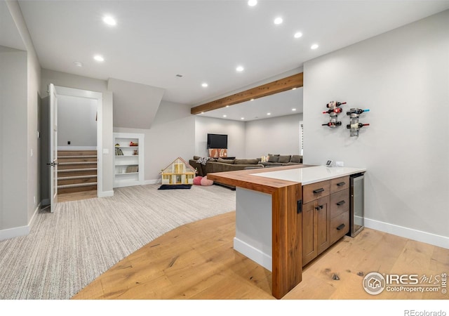 kitchen featuring light wood-type flooring and wine cooler