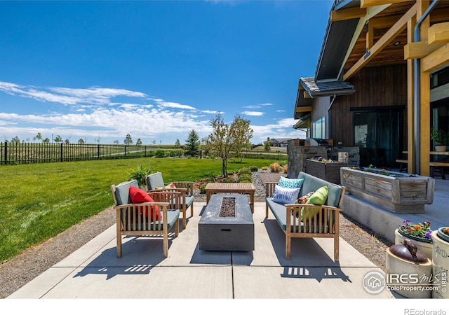 view of patio / terrace featuring an outdoor living space with a fire pit