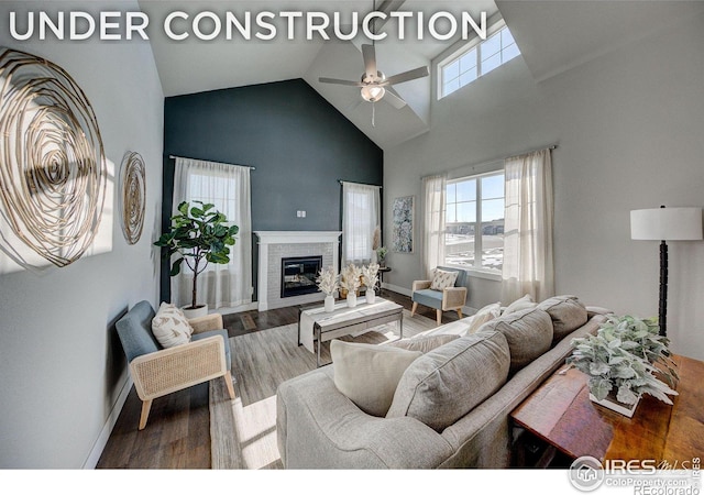 living room with ceiling fan, hardwood / wood-style flooring, and lofted ceiling