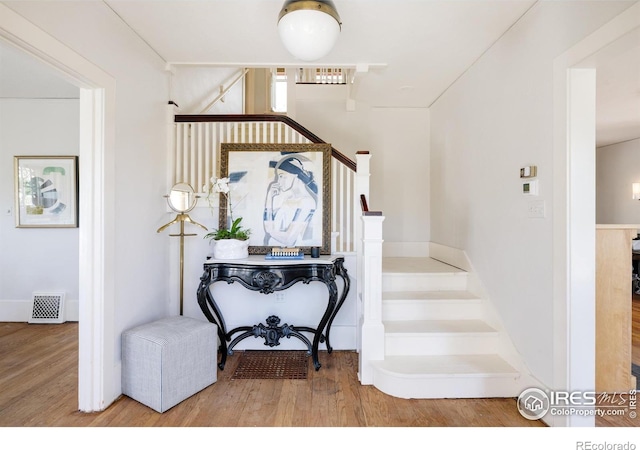 stairs with wood-type flooring