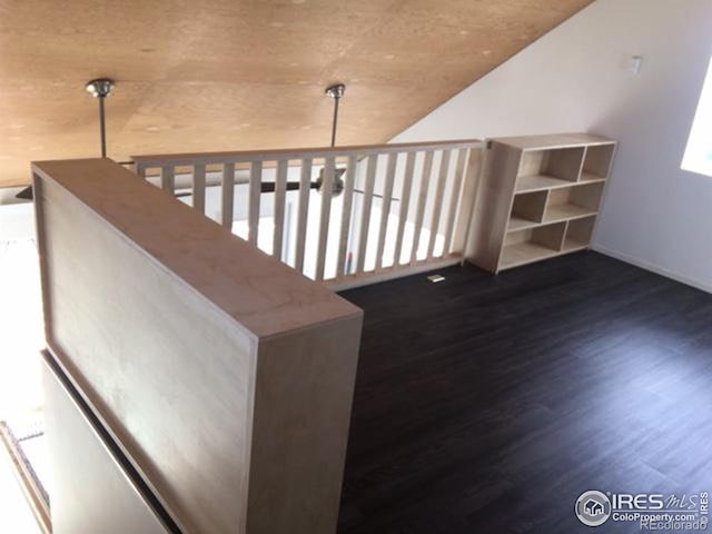 stairway featuring dark hardwood / wood-style flooring