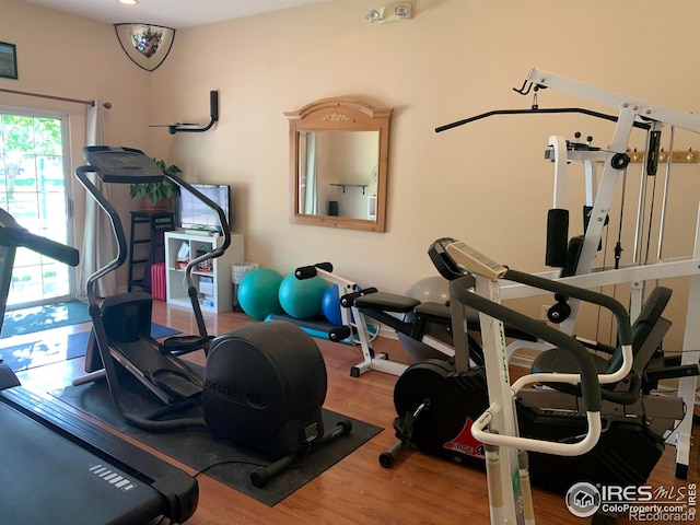 exercise area with hardwood / wood-style flooring