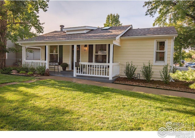 view of front of home with a lawn and covered porch