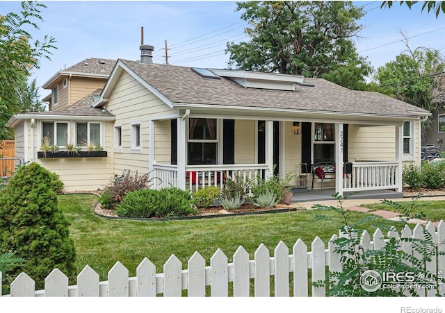 view of front of house featuring a front yard and a porch