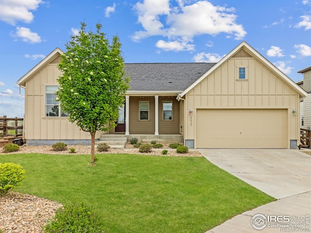 view of front of home with a garage and a front yard