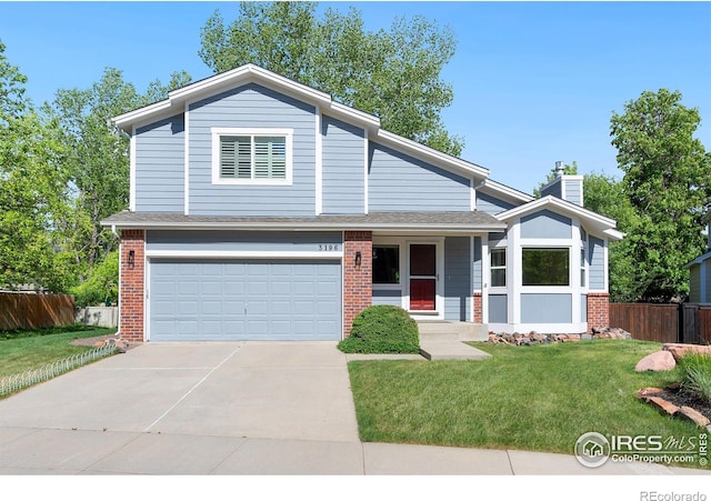 view of front facade with a front lawn and a garage