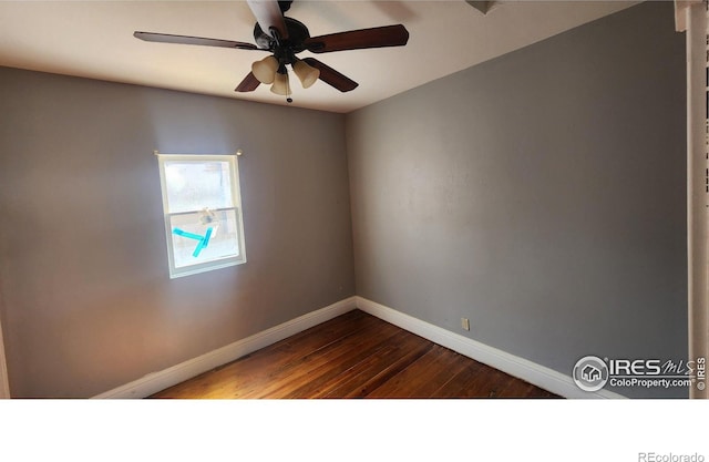 spare room with wood-type flooring and ceiling fan