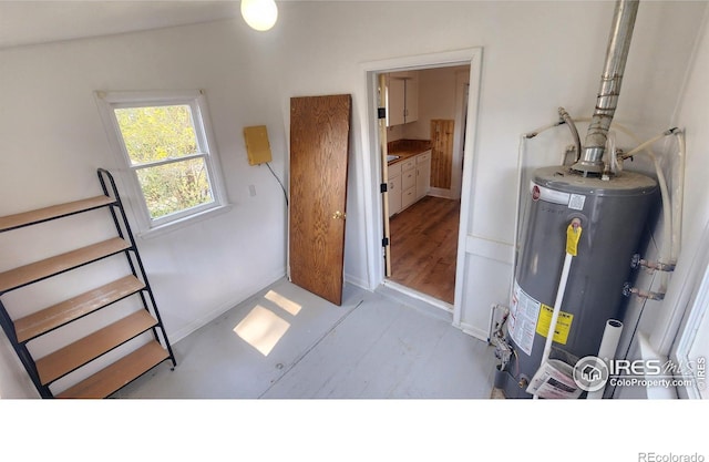 utility room featuring gas water heater