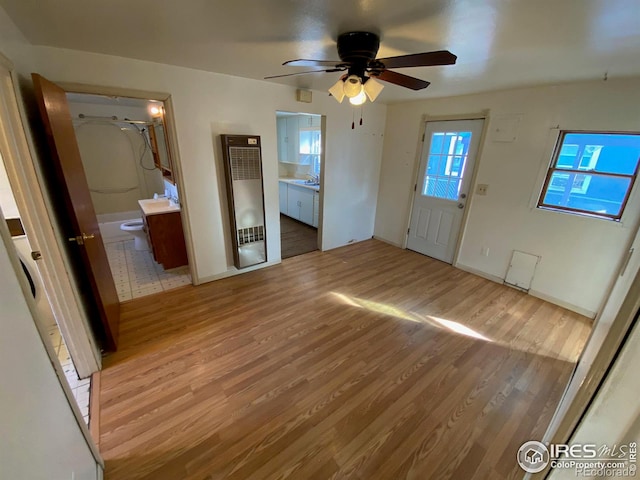 interior space featuring ceiling fan and light hardwood / wood-style flooring