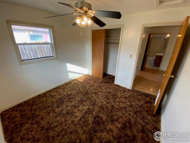 unfurnished bedroom featuring wood-type flooring, a closet, and ceiling fan