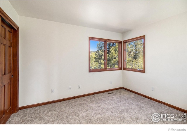 view of carpeted spare room